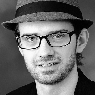 Jason David Cook wearing glasses and a hat